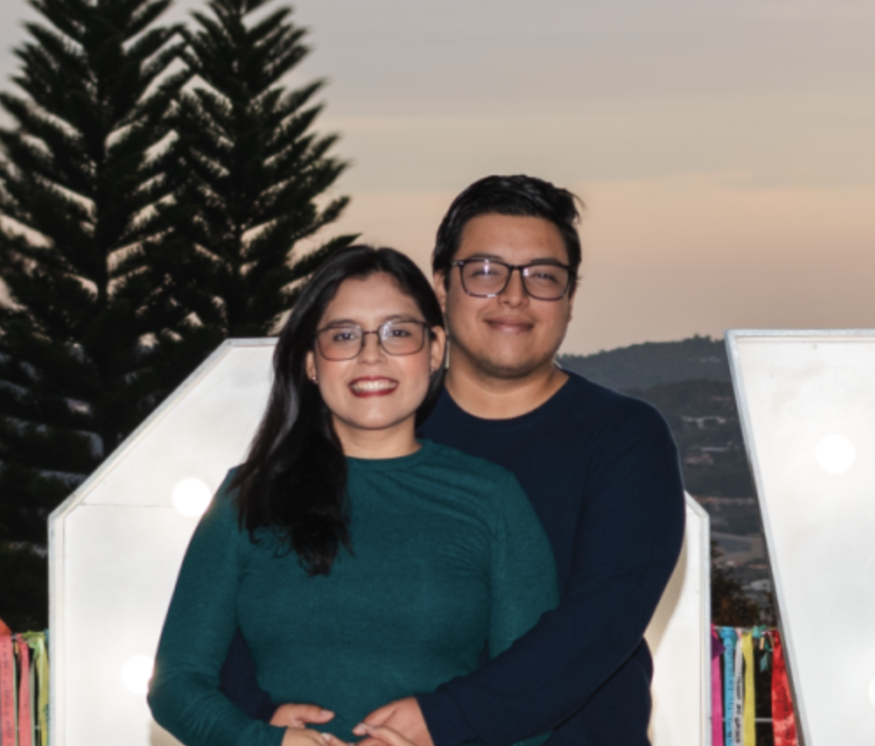 Portrait of a man with glasses wearing a gray shirt.